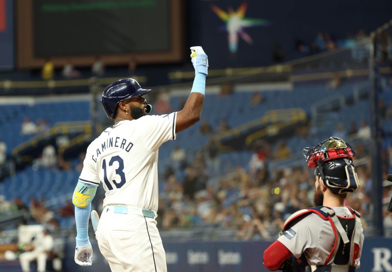 Sep 17, 2024; St. Petersburg, Florida, USA;  Tampa Bay Rays third baseman Junior Caminero (13) celebrates after hitting a home run against the Boston Red Sox  during the fourth inning at Tropicana Field. Mandatory Credit: Kim Klement Neitzel-Imagn Images