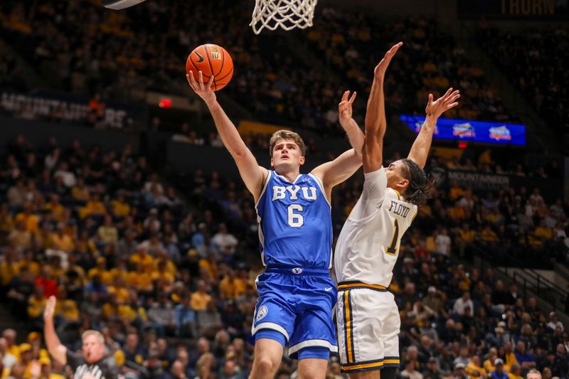 Feb 28, 2026; Morgantown, West Virginia, USA; BYU Cougars guard Aleksej Kostić (6) shoots against West Virginia Mountaineers guard Jasper Floyd (1) during the first half at Hope Coliseum. Mandatory Credit: Ben Queen-Imagn Images