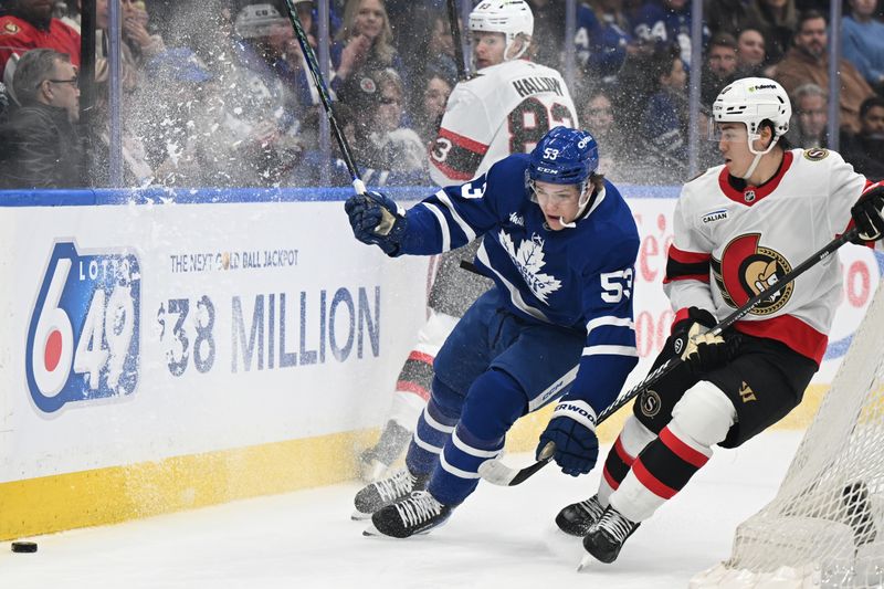 Feb 28, 2026; Toronto, Ontario, CAN;  Toronto Maple Leafs forward Easton Cowan (53) pursues the puck against Ottawa Senators defenseman Jordan Spence (10) in the first period at Scotiabank Arena. Mandatory Credit: Dan Hamilton-Imagn Images