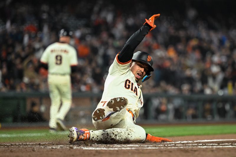 May 1, 2025; San Francisco, California, USA; San Francisco Giants shortstop Willy Adames (2) slides home against the Colorado Rockies in the sixth inning at Oracle Park. Mandatory Credit: Eakin Howard-Imagn Images