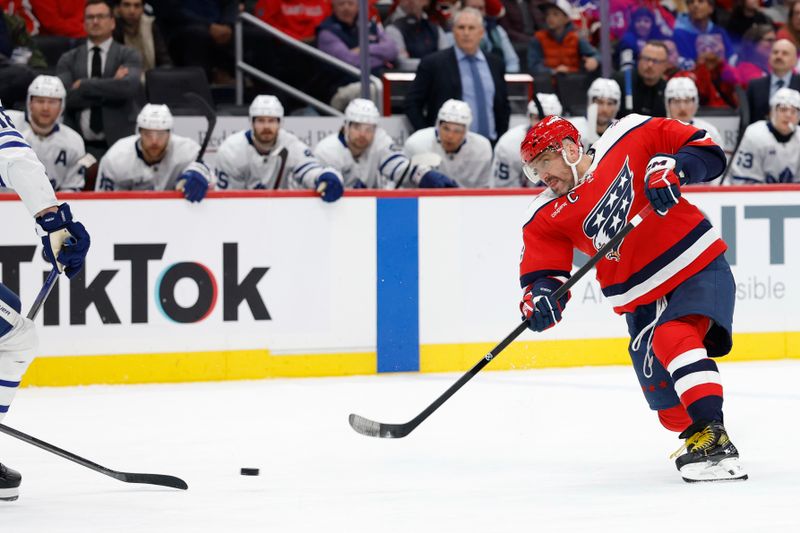 Nov 28, 2025; Washington, District of Columbia, USA; Washington Capitals left wing Alex Ovechkin (8) shoots the puck against the Toronto Maple Leafs during the third period at Capital One Arena. Mandatory Credit: Geoff Burke-Imagn Images