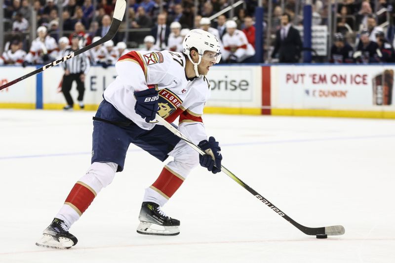 Oct 24, 2024; New York, New York, USA;  Florida Panthers center Eetu Luostarinen (27) skates down ice on a breakaway in the first period against the New York Rangers at Madison Square Garden. Mandatory Credit: Wendell Cruz-Imagn Images