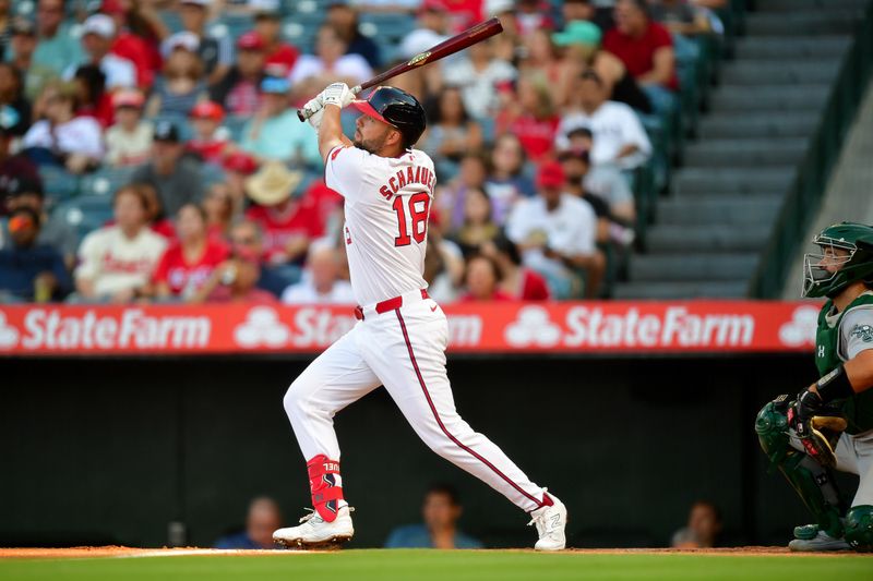 Jul 26, 2024; Anaheim, California, USA; Los Angeles Angels first baseman Nolan Schanuel (18) hits a two run home run against the Oakland Athletics during the first inning at Angel Stadium. Mandatory Credit: Gary A. Vasquez-USA TODAY Sports