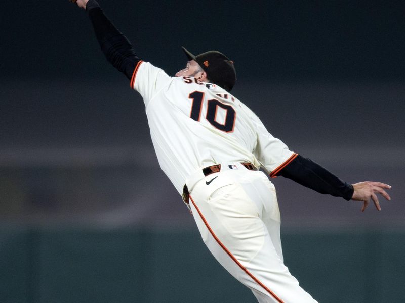 Sep 22, 2025; San Francisco, California, USA; San Francisco Giants second baseman Casey Schmitt (10) makes a leaping catch of a line drive by St. Louis Cardinals center fielder Victor Scott II during the sixth inning at Oracle Park. Mandatory Credit: D. Ross Cameron-Imagn Images