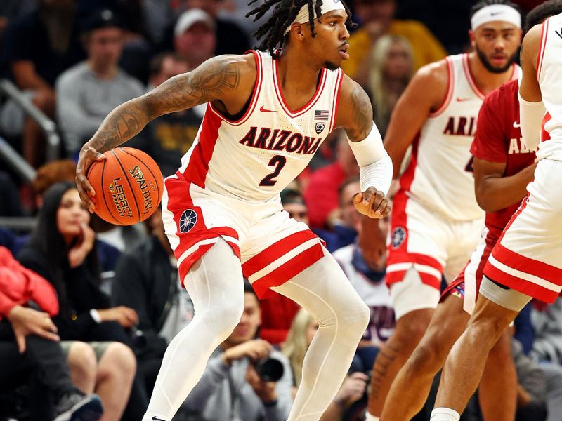 Dec 20, 2023; Phoenix, Arizona, USA; Arizona Wildcats guard Caleb Love (2) handles the ball during the first half of the game against the Alabama Crimson Tide in the Hall of Fame Series at Footprint Center. Mandatory Credit: Mark J. Rebilas-USA TODAY Sports