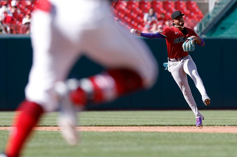 Jun 19, 2024; Washington, District of Columbia, USA; Arizona Diamondbacks second base Ketel Marte (4) makes a throw to first base on a ground ball by Washington Nationals first base Joey Meneses (L) during the fourth inning at Nationals Park. Mandatory Credit: Geoff Burke-USA TODAY Sports