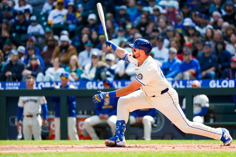 Apr 13, 2025; Seattle, Washington, USA; Seattle Mariners catcher Cal Raleigh (29) hits a two-run home run against the Texas Rangers during the first inning at T-Mobile Park. Mandatory Credit: Joe Nicholson-Imagn Images
