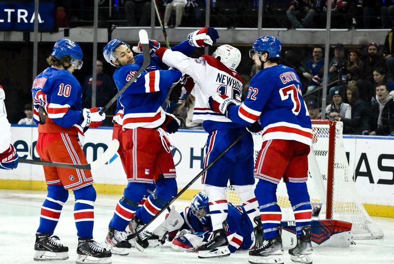 Nov 30, 2024; New York, New York, USA; New York Rangers defenseman K'Andre Miller (79) and Montreal Canadiens center Alex Newhook (15) scuffle during the second period at Madison Square Garden. Mandatory Credit: John Jones-Imagn Images