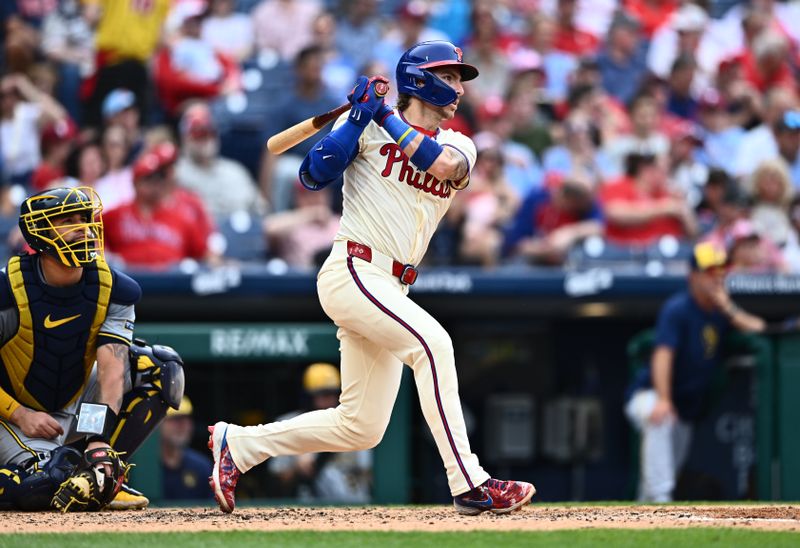 Jun 5, 2024; Philadelphia, Pennsylvania, USA; Philadelphia Phillies second baseman Bryson Stott (5) hits a single against the Milwaukee Brewers in the sixth inning at Citizens Bank Park. Mandatory Credit: Kyle Ross-USA TODAY Sports