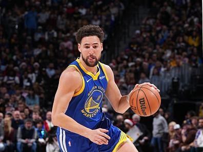 DENVER, CO - DECEMBER 25: Klay Thompson #11 of the Golden State Warriors dribbles the ball during the game against the Denver Nuggets on December 25, 2023 at the Ball Arena in Denver, Colorado. NOTE TO USER: User expressly acknowledges and agrees that, by downloading and/or using this Photograph, user is consenting to the terms and conditions of the Getty Images License Agreement. Mandatory Copyright Notice: Copyright 2023 NBAE (Photo by Garrett Ellwood/NBAE via Getty Images)