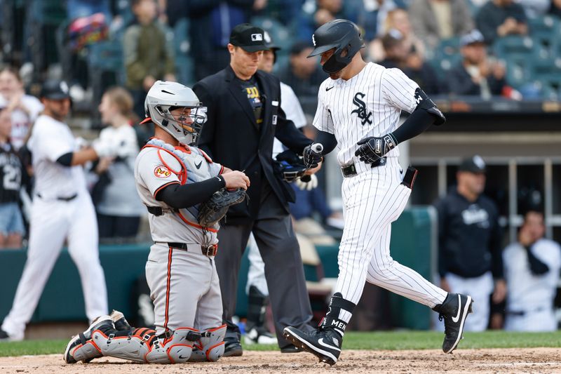 May 26, 2024; Chicago, Illinois, USA; Chicago White Sox third baseman Danny Mendick (0) crosses home plate after hitting a solo home run against the Baltimore Orioles during the eight inning at Guaranteed Rate Field. Mandatory Credit: Kamil Krzaczynski-USA TODAY Sports