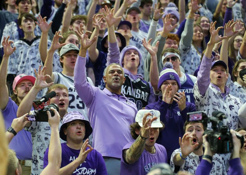 Feb 18, 2023; Manhattan, Kansas, USA; Kansas State Wildcats head coach Jerome Tang celebrates with fans in the stands following a win against the Iowa State Cyclones at Bramlage Coliseum. Mandatory Credit: Scott Sewell-USA TODAY Sports