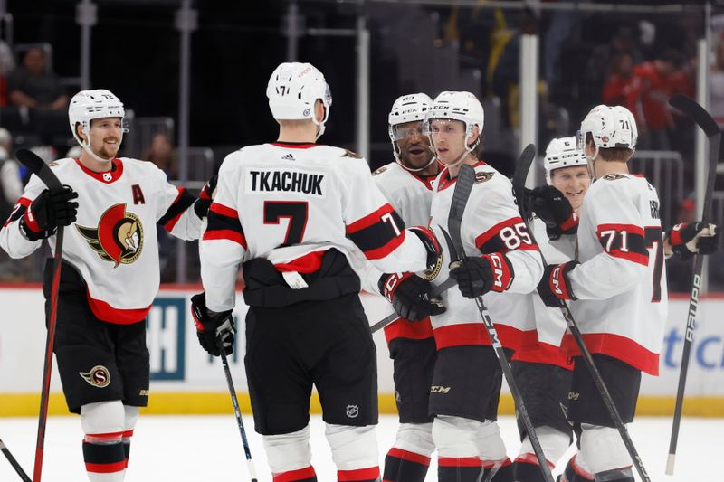 Apr 7, 2024; Washington, District of Columbia, USA; Ottawa Senators defenseman Jake Sanderson (85) celebrates with teammates after scoring the game-winning goal in overtime against the Washington Capitals at Capital One Arena. Mandatory Credit: Geoff Burke-USA TODAY Sports