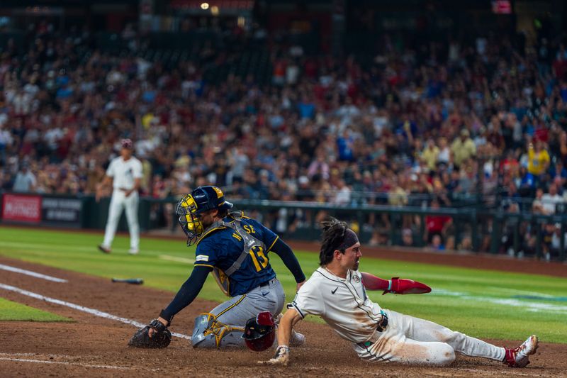 Sep 15, 2024; Phoenix, Arizona, USA; Arizona Diamondbacks outfielder Corbin Carroll (7) loses his helmet as he slides in to score past Milwaukee Brewers catcher Eric Haase (13) in the eighth inning during a game at Chase Field. Mandatory Credit: Allan Henry-Imagn Images