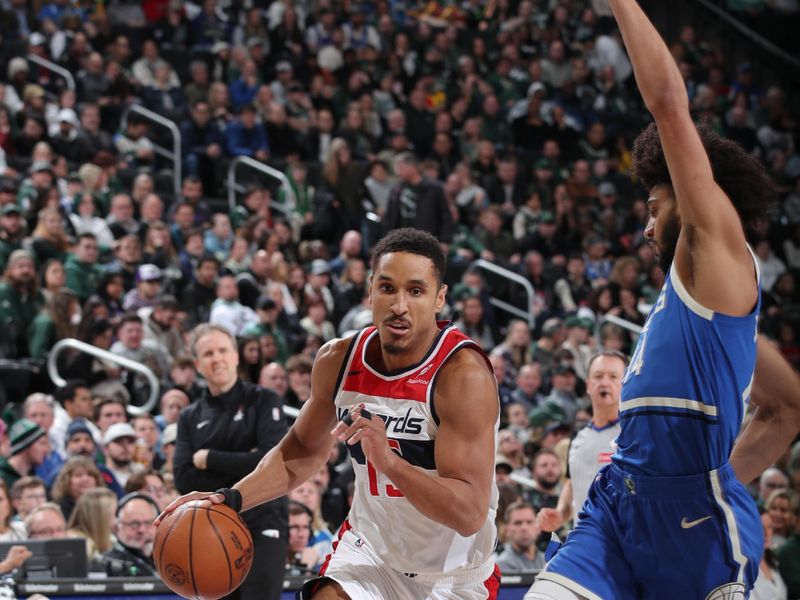 MILWAUKEE, WI - NOVEMBER 30: Malcolm Brogdon #15 of the Washington Wizards drives to the basket during the game against the Milwaukee Bucks on November 30, 2024 at Fiserv Forum Center in Milwaukee, Wisconsin. NOTE TO USER: User expressly acknowledges and agrees that, by downloading and or using this Photograph, user is consenting to the terms and conditions of the Getty Images License Agreement. Mandatory Copyright Notice: Copyright 2024 NBAE (Photo by Gary Dineen/NBAE via Getty Images).