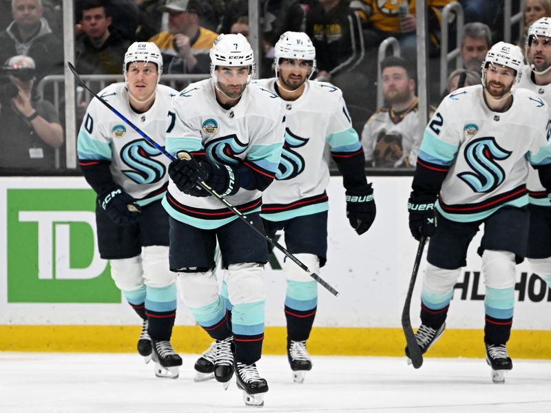 Feb 15, 2024; Boston, Massachusetts, USA; Seattle Kraken right wing Jordan Eberle (7) celebrates with his teammates after scoring a goal against the Boston Bruins during the first period at TD Garden. Mandatory Credit: Brian Fluharty-USA TODAY Sports