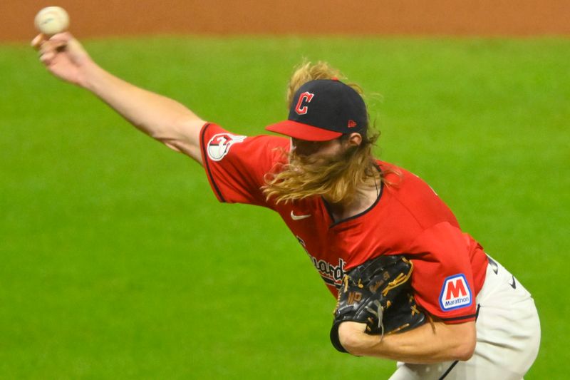 Aug 27, 2024; Cleveland, Ohio, USA; Cleveland Guardians relief pitcher Scott Barlow (58) delivers a pitch in the seventh inning against the Kansas City Royals at Progressive Field. Mandatory Credit: David Richard-USA TODAY Sports