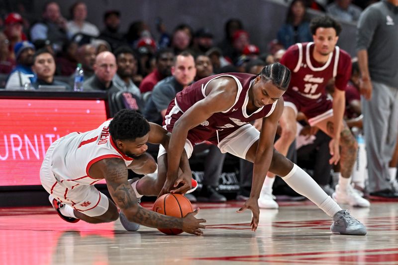 Nov 16, 2022; Houston, Texas, USA; Houston Cougars guard Jamal Shead (1) and Texas Southern Tigers forward Davon Barnes (2) scramble for a loose ball during the second half at Fertitta Center. Mandatory Credit: Maria Lysaker-USA TODAY Sports