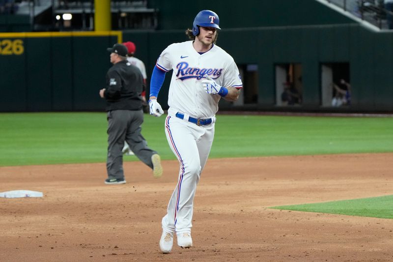 Apr 14, 2022; Arlington, Texas, USA; Texas Rangers catcher Jonah Heim (28) rounds the bases on his grand slam home run against the Los Angeles Angels during the fourth inning of a baseball game at Globe Life Field. Mandatory Credit: Jim Cowsert-USA TODAY Sports