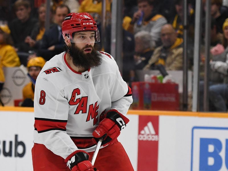 Dec 27, 2023; Nashville, Tennessee, USA; Carolina Hurricanes defenseman Brent Burns (8) handles the puck during the second period against the Nashville Predators at Bridgestone Arena. Mandatory Credit: Christopher Hanewinckel-USA TODAY Sports