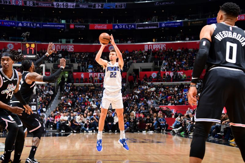 LOS ANGELES, CA - MARCH 18: Franz Wagner #22 of the Orlando Magic shoots a three point basket during the game against the LA Clippers on March 18, 2023 at Crypto.Com Arena in Los Angeles, California. NOTE TO USER: User expressly acknowledges and agrees that, by downloading and/or using this Photograph, user is consenting to the terms and conditions of the Getty Images License Agreement. Mandatory Copyright Notice: Copyright 2023 NBAE (Photo by Adam Pantozzi/NBAE via Getty Images)