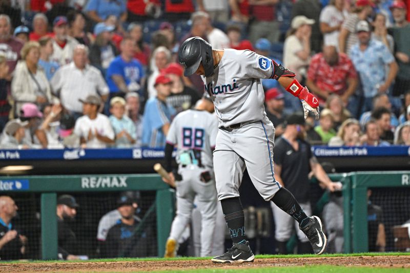 Sep 23, 2025; Philadelphia, Pennsylvania, USA; Miami Marlins outfielder Heriberto Hernández (64) steps on home after hitting a home run during the ninth inning against the Philadelphia Phillies at Citizens Bank Park. Mandatory Credit: Eric Hartline-Imagn Images