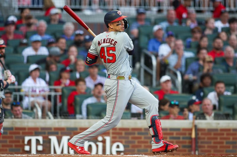 May 30, 2024; Atlanta, Georgia, USA; Washington Nationals first baseman Joey Meneses (45) hits a two-run double against the Atlanta Braves in the third inning at Truist Park. Mandatory Credit: Brett Davis-USA TODAY Sports