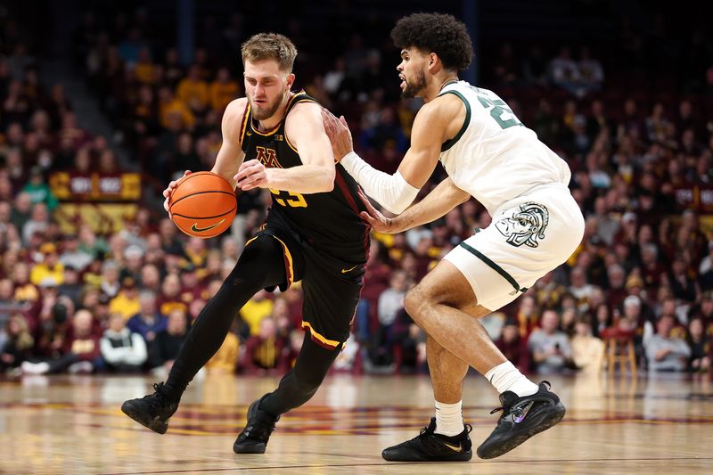 Feb 6, 2024; Minneapolis, Minnesota, USA; Minnesota Golden Gophers forward Parker Fox (23) works around Michigan State Spartans forward Malik Hall (25) during the first half at Williams Arena. Mandatory Credit: Matt Krohn-USA TODAY Sports