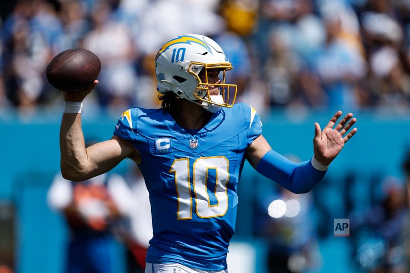 Los Angeles Chargers quarterback Justin Herbert (10) throws to a receiver during their NFL football game against the Tennessee Titans Sunday, Sept. 17, 2023, in Nashville, Tenn. (AP Photo/Wade Payne)