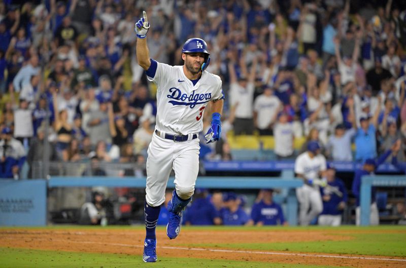 Sep 24, 2023; Los Angeles, California, USA;  Los Angeles Dodgers shortstop Chris Taylor (3) celebrates after hitting a walk-off RBI single to defeat the San Francisco Giants in the tenth inning at Dodger Stadium. Mandatory Credit: Jayne Kamin-Oncea-USA TODAY Sports