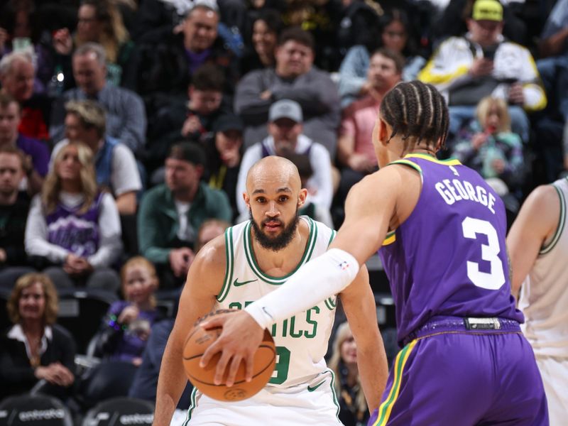 SALT LAKE CITY, UT - MARCH 12:  Derrick White #9 of the Boston Celtics plays defense during the game  against Keyonte George #3 of the Utah Jazz on March 12, 2024 at Delta Center in Salt Lake City, Utah. NOTE TO USER: User expressly acknowledges and agrees that, by downloading and or using this Photograph, User is consenting to the terms and conditions of the Getty Images License Agreement. Mandatory Copyright Notice: Copyright 2024 NBAE (Photo by Melissa Majchrzak/NBAE via Getty Images)