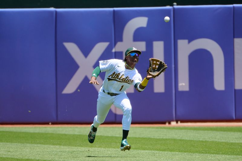 Jun 17, 2023; Oakland, California, USA; Oakland Athletics outfielder Esteury Ruiz (1) catches a fly ball against the Philadelphia Phillies during the first inning at Oakland-Alameda County Coliseum. Mandatory Credit: Robert Edwards-USA TODAY Sports