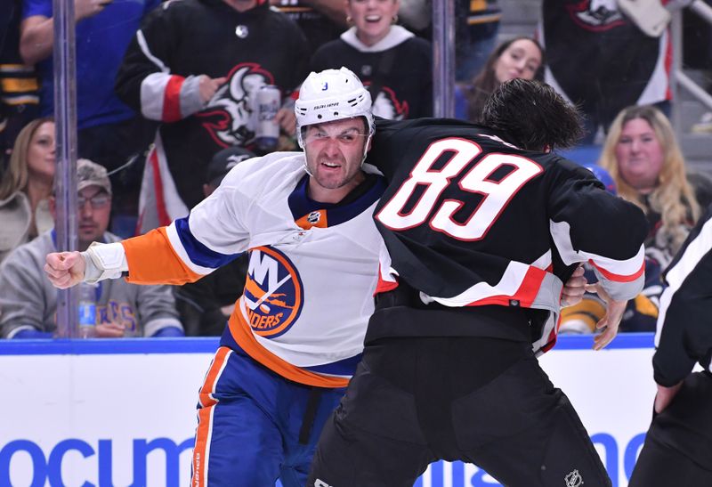 Oct 21, 2023; Buffalo, New York, USA; New York Islanders defenseman Adam Pelech (3) and Buffalo Sabres right wing Alex Tuch (89) break into a fight in the second period  at KeyBank Center. Mandatory Credit: Mark Konezny-USA TODAY Sports