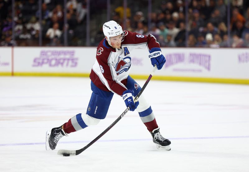 Nov 30, 2023; Tempe, Arizona, USA; Colorado Avalanche defenseman Cale Makar (8) shoots the puck against the Arizona Coyotes in the first period at Mullett Arena. Mandatory Credit: Mark J. Rebilas-USA TODAY Sports