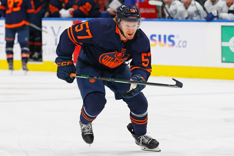 Dec 14, 2023; Edmonton, Alberta, CAN; Edmonton Oilers forward James Hamblin (57)  chases a loose puck against there Tampa Bay Lightning at Rogers Place. Mandatory Credit: Perry Nelson-USA TODAY Sports