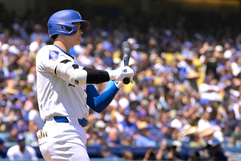 Aug 25, 2024; Los Angeles, California, USA;  Los Angeles Dodgers designated hitter Shohei Ohtani (17) flies out in the first inning against the Tampa Bay Rays at Dodger Stadium. Mandatory Credit: Jayne Kamin-Oncea-USA TODAY Sports