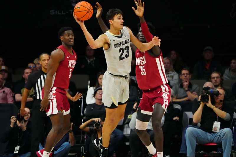 Jan 22, 2023; Boulder, Colorado, USA; Colorado Buffaloes forward Tristan da Silva (23) passes the ball away from Washington State Cougars forward Mouhamed Gueye (35) in the second half at the CU Events Center. Mandatory Credit: Ron Chenoy-USA TODAY Sports