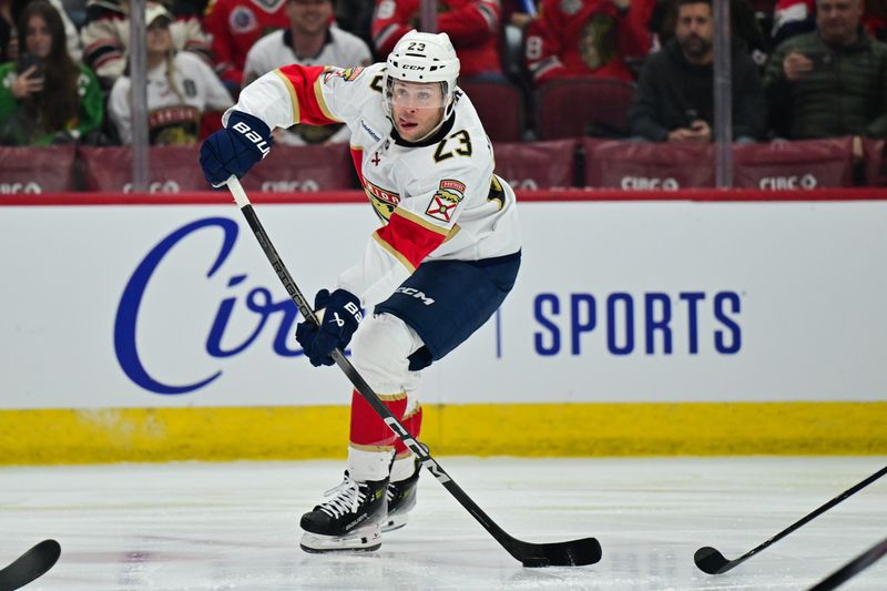 Nov 21, 2024; Chicago, Illinois, USA; Florida Panthers center Carter Verhaeghe (23) skates with the puck against the Chicago Blackhawks during the first period at the United Center. Mandatory Credit: Daniel Bartel-Imagn Images