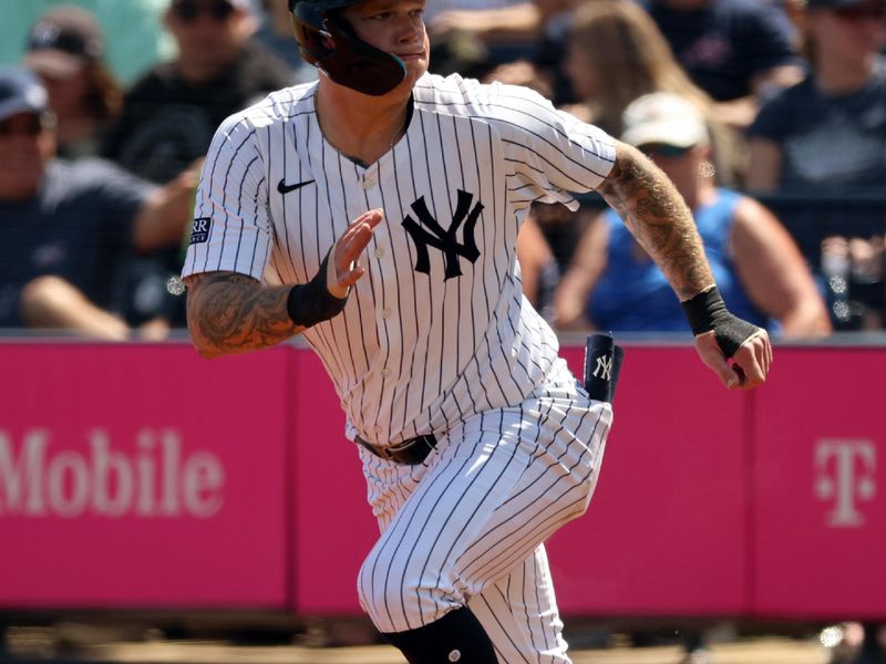 Mar 10, 2024; Tampa, Florida, USA; New York Yankees right fielder Alex Verdugo (24) leads off first base during the second inning against the Atlanta Braves at George M. Steinbrenner Field. Mandatory Credit: Kim Klement Neitzel-USA TODAY Sports