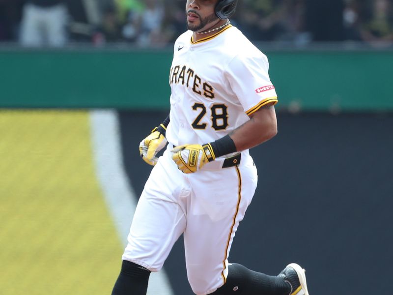 Jun 29, 2025; Pittsburgh, Pennsylvania, USA;  Pittsburgh Pirates left fielder Tommy Pham (28) circles the bases on a solo home run against the New York Mets during the first inning at PNC Park. Mandatory Credit: Charles LeClaire-Imagn Images