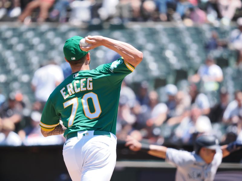 Jun 29, 2023; Oakland, California, USA; Oakland Athletics relief pitcher Lucas Greg (70) throws the ball to try to catch the New York Yankees runner taking a lead off during the sixth inning at Oakland-Alameda County Coliseum. Mandatory Credit: Kelley L Cox-USA TODAY Sports