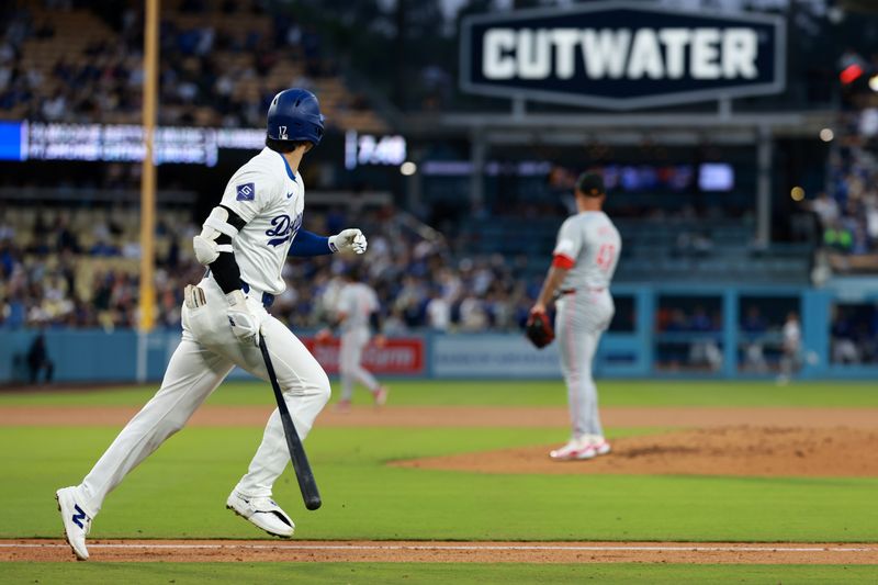 May 17, 2024; Los Angeles, California, USA;  Los Angeles Dodgers designated hitter Shohei Ohtani (17) hits a home run during the third inning against the Cincinnati Reds at Dodger Stadium. Mandatory Credit: Kiyoshi Mio-USA TODAY Sports