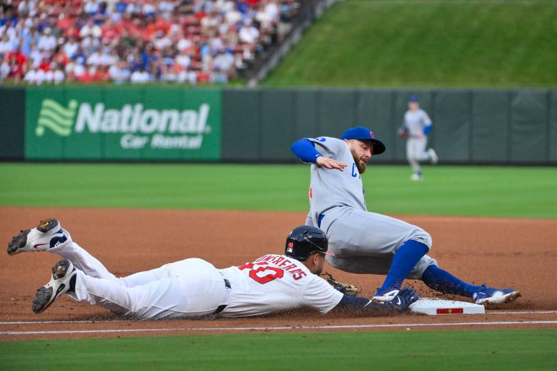 Aug 10, 2025; St. Louis, Missouri, USA;  Chicago Cubs first baseman Michael Busch (29) slides and forces out St. Louis Cardinals first baseman Willson Contreras (40) during the first inning at Busch Stadium. Mandatory Credit: Jeff Curry-Imagn Images