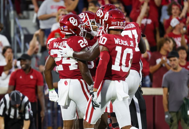 Sep 10, 2022; Norman, Oklahoma, USA;  Oklahoma Sooners running back Marcus Major (24) celebrates with teammates after scoring a touchdown during the second half against the Kent State Golden Flashes at Gaylord Family-Oklahoma Memorial Stadium. Mandatory Credit: Kevin Jairaj-USA TODAY Sports