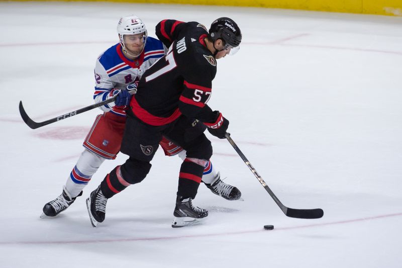 Jan 27, 2024; Ottawa, Ontario, CAN; New York Rangers center Jonny Brodzinski (22) battles with Ottawa Senators center Shane Pinto (57) in the third period at the Canadian Tire Centre. Mandatory Credit: Marc DesRosiers-USA TODAY Sports