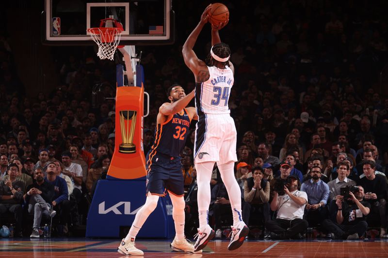 NEW YORK, NY - DECEMBER 3: Wendell Carter Jr. #34 of the Orlando Magic shoots a three point basket during the game  against the New York Knicks during the Emirates NBA Cup on December 3, 2024 at Madison Square Garden in New York City, New York.  NOTE TO USER: User expressly acknowledges and agrees that, by downloading and or using this photograph, User is consenting to the terms and conditions of the Getty Images License Agreement. Mandatory Copyright Notice: Copyright 2024 NBAE  (Photo by Nathaniel S. Butler/NBAE via Getty Images)