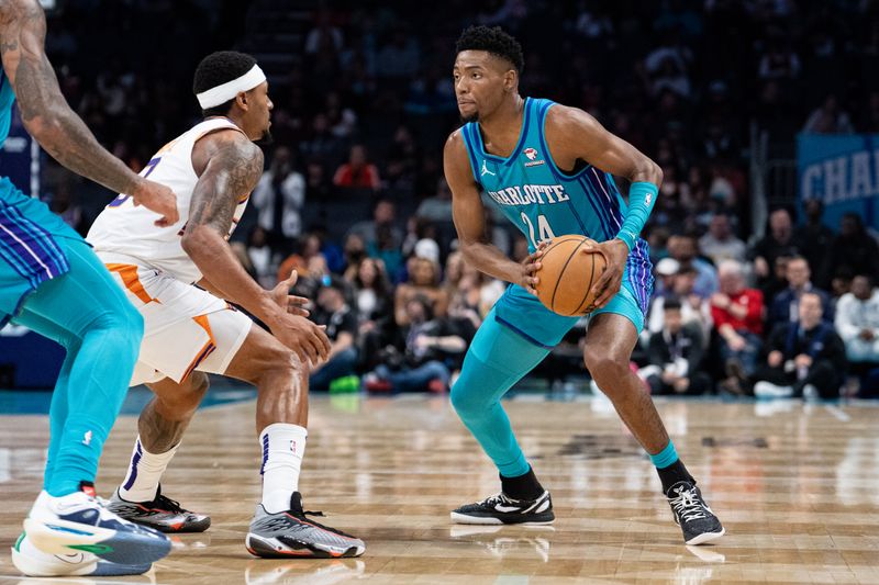 CHARLOTTE, NORTH CAROLINA - MARCH 15: Bradley Beal #3 of the Phoenix Suns guards Brandon Miller #24 of the Charlotte Hornets in the second quarter during their game at Spectrum Center on March 15, 2024 in Charlotte, North Carolina. NOTE TO USER: User expressly acknowledges and agrees that, by downloading and or using this photograph, User is consenting to the terms and conditions of the Getty Images License Agreement. (Photo by Jacob Kupferman/Getty Images)