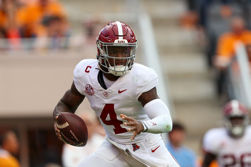 Oct 19, 2024; Knoxville, Tennessee, USA; Alabama Crimson Tide quarterback Jalen Milroe (4) scrambles against the Tennessee Volunteers during the second quarter at Neyland Stadium. Mandatory Credit: Randy Sartin-Imagn Images