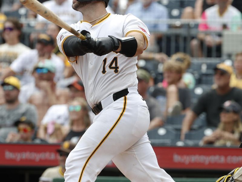 Aug 8, 2024; Pittsburgh, Pennsylvania, USA;  Pittsburgh Pirates catcher Joey Bart (14) hits a two run home run against the San Diego Padres during the seventh inning at PNC Park. Mandatory Credit: Charles LeClaire-USA TODAY Sports