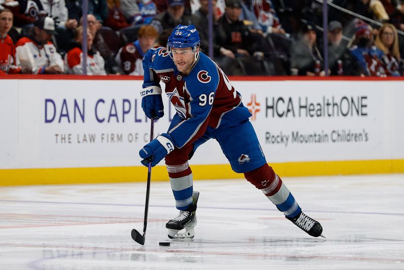 Nov 15, 2024; Denver, Colorado, USA; Colorado Avalanche right wing Mikko Rantanen (96) controls the puck in the second period against the Washington Capitals at Ball Arena. Mandatory Credit: Isaiah J. Downing-Imagn Images